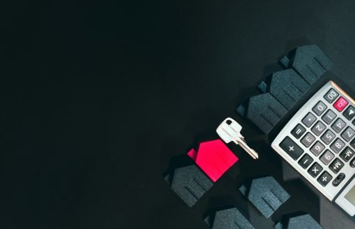 A cell phone sitting on top of a keyboard